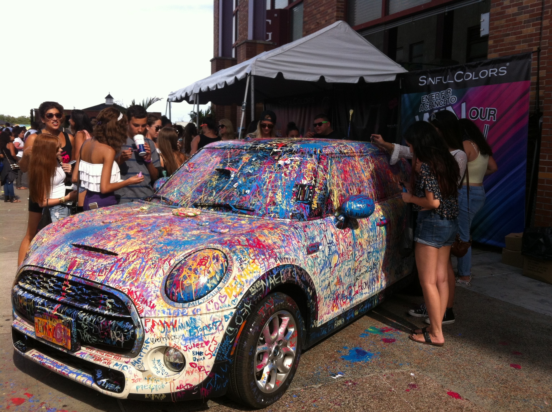 Car paint. Car being decorated with nail polish by music